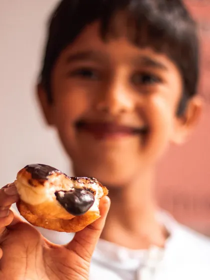 The pure, unfiltered look of happiness. There's nothing better than seeing our youngest customers enjoy their favorite treats.