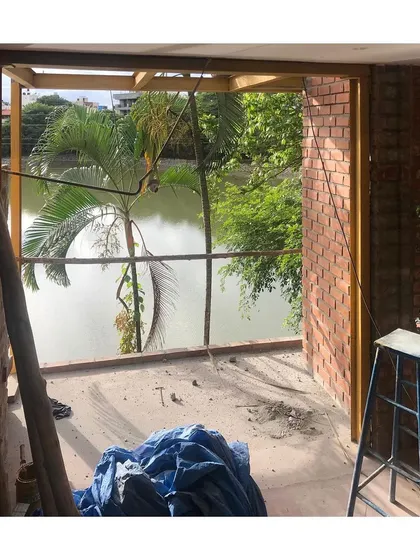 The 'Keremane' lake house under construction, with its primary structure and window openings established. This stage is exciting, as the architectural vision begins to become a physical reality.