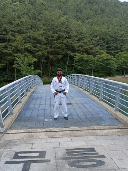 On a bridge in Muju, with the Korean characters for 'Mureung' visible on the ground.