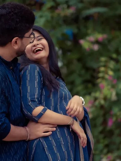 Pure, uninhibited laughter is what we love to capture. This candid shot from a pre-wedding session shows a moment of genuine joy and connection.