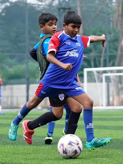 A player shields the ball from his BFC Academy opponent. These fixtures are a stepping stone, providing exposure and learning opportunities.