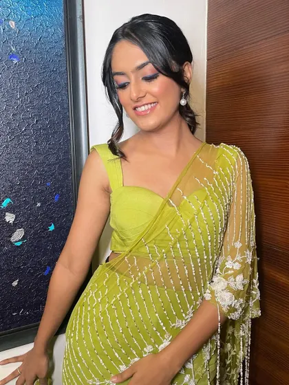 Another beautiful shot of this soft and classic makeup look. The messy-chic updo adds a modern touch to the traditional saree.