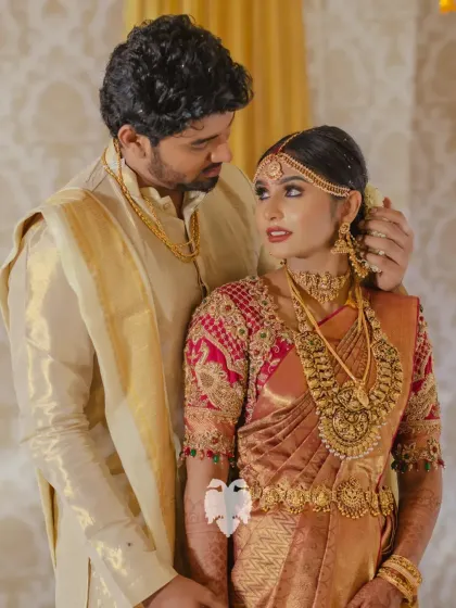 A beautiful moment captured of Priya and her groom, her regal maroon blouse a central part of her bridal story.