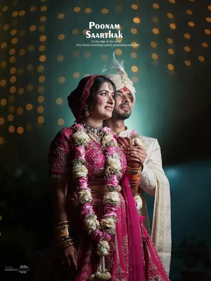 A beautifully composed couple portrait with a creative use of bokeh lights. This image captures the couple in a quiet moment amidst the wedding celebrations, looking towards their future together.