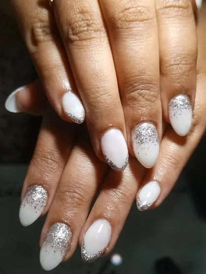 This is a very popular bridal choice. I created a soft, milky white base and added a beautiful silver glitter ombre starting from the tips for a dazzling effect.