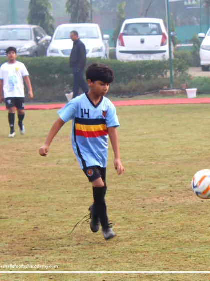 A player controlling the ball during a Golden League match. These games provide the perfect platform to apply the skills learned in training.