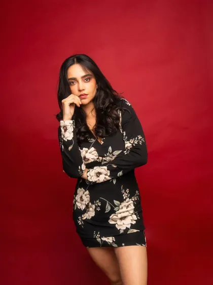 The bold red background creates a powerful, high-energy vibe. This kind of shot is perfect for making a strong statement in a portfolio.