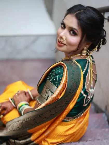 A gorgeous Maharashtrian bride. I loved creating this look with the traditional nauvari saree, nath, and a beautiful hairstyle featuring fresh yellow flowers.