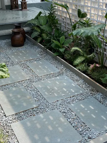 A detail of the landscaping at Summer Haus, where we used a combination of gravel and stone pavers to create a textured pathway. The breeze block wall adds another layer of pattern and detail to the outdoor space.
