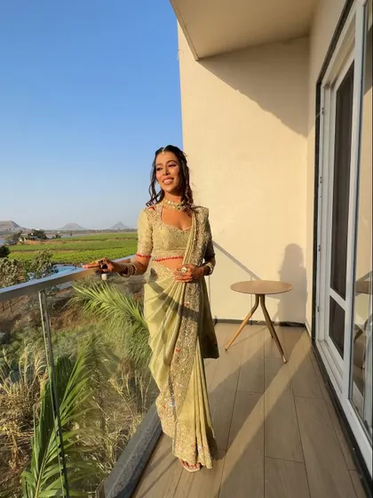 A real client enjoying the golden hour in her beautifully draped saree. My goal is to make you feel comfortable and look stunning in any setting.