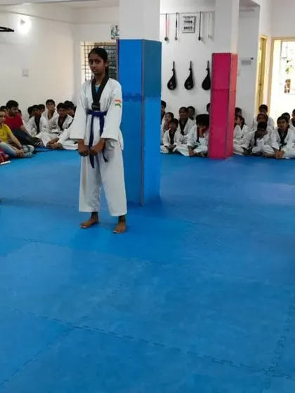 Three students in a ready stance.