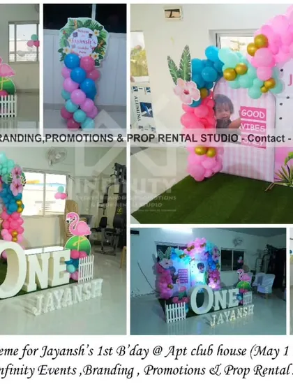 A tropical flamingo theme for a first birthday. The setup includes a double semi-arch backdrop, pink and teal balloons, and flamingo props for a fun and vibrant celebration.