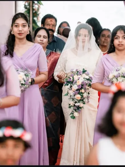 The bride's procession down the aisle, accompanied by her bridesmaids. A classic and beautiful moment we always capture.