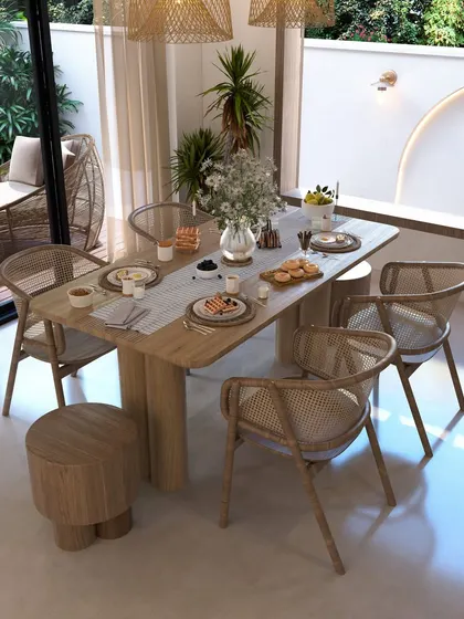 This dining space blends a boho soul with natural minimalism. Rattan chairs, a simple wooden table, and woven pendant lights create a casual, light-filled escape perfect for slow mornings and mindful conversations.