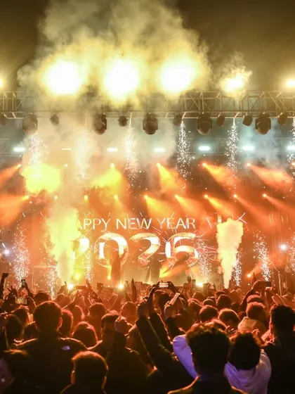 The countdown moment. Fireworks and smoke erupt as we ring in the New Year on stage, a truly explosive and joyous celebration.