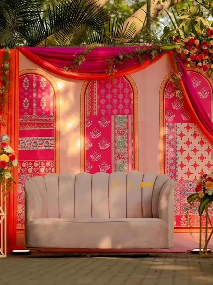 A Mehendi ceremony should be full of joy and color. We designed this vibrant backdrop using traditional block prints in bold pinks and oranges, creating the perfect setting for celebration.