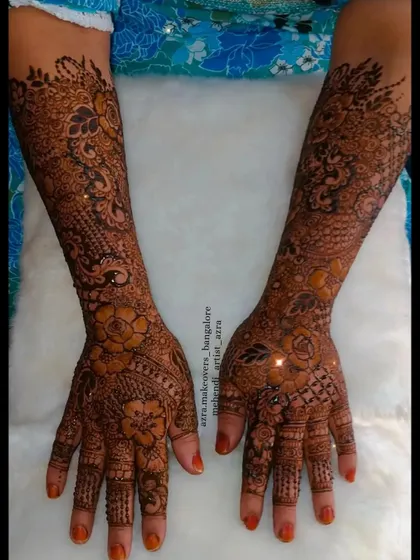 A non-bridal but heavy floral design covering the full arms, perfect for a close family member or an engagement ceremony.