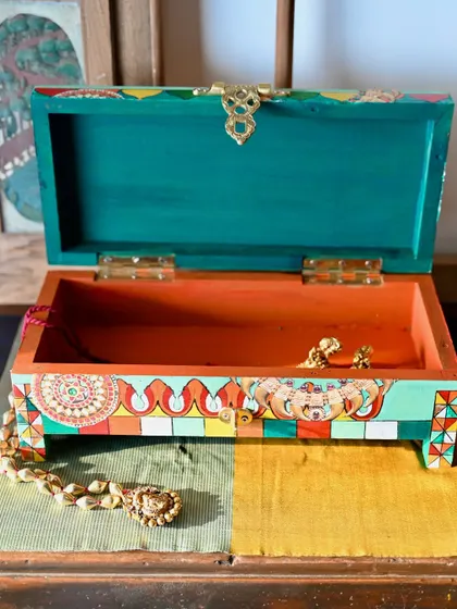 The box is shown open, revealing the contrasting interior color. It's a functional piece designed to be beautiful both inside and out.