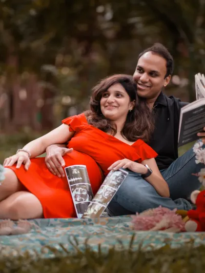 A relaxing day in the park, dreaming of the future. This casual outdoor maternity picnic setup with ultrasound photos is a lovely way to capture your story.