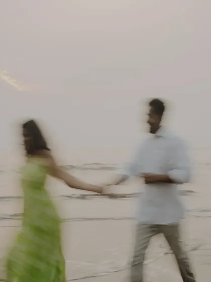 A dreamy, motion-blur photograph capturing the feeling of being swept away by love. This artistic shot from a beach pre-wedding session adds a touch of abstract beauty to your gallery.