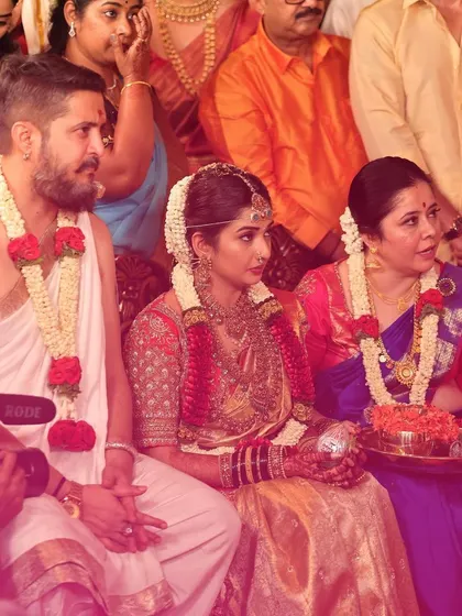 A candid shot from the wedding ceremony. It's a privilege to witness these moments and know that my designs are a part of their lifelong memories.
