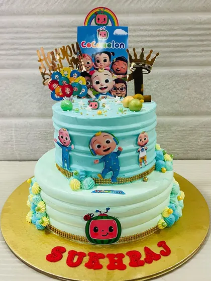 A slightly different view of the two-tiered Cocomelon cake, showcasing the fun and festive design that kids absolutely love.