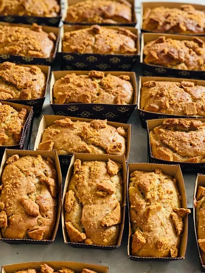 A batch of my popular Biscoff banana mini loaves, fresh from the oven. The combination of moist banana bread and crunchy, caramelized Biscoff biscuit topping is absolutely delicious.
