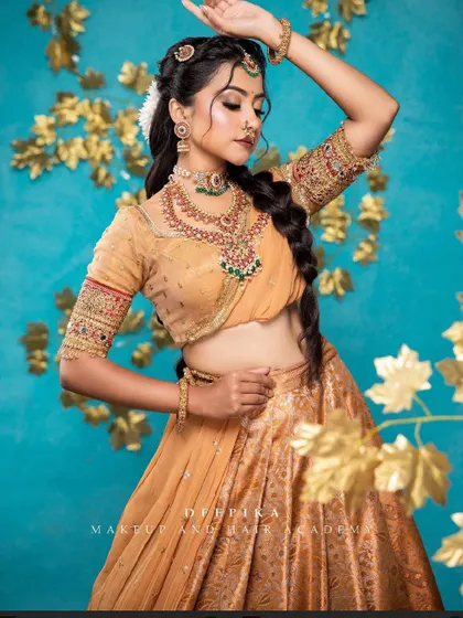 I love this elegant half saree look. The mustard gold skirt is paired with a simple blouse and a sheer dupatta, creating a sophisticated style for any pre-wedding event.