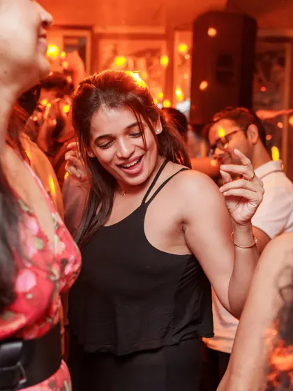 That feeling when your favorite old school track comes on. A guest smiling and dancing, lost in the moment.