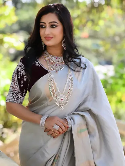 The full three-layer AD stone haram is a showstopper. It pairs beautifully with a simple, elegant saree for a sophisticated evening look.