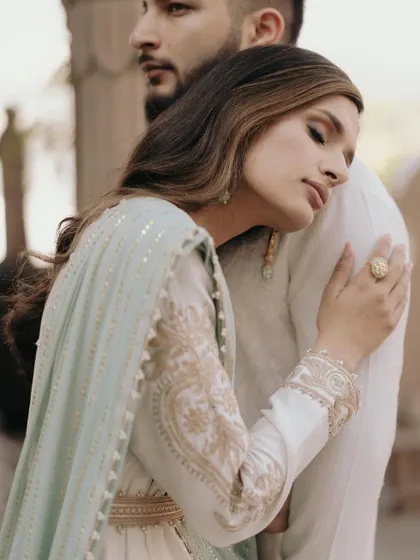 An intimate and emotional close-up of Amani and TJ. The bride's gentle embrace conveys a sense of peace and deep connection.
