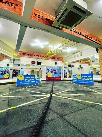The stage is set for our Tug of War competition. You can see our motivational banners in the background, reminding everyone that "Nothing will work unless you do." It’s this spirit that fuels our fun and challenging in-gym events.