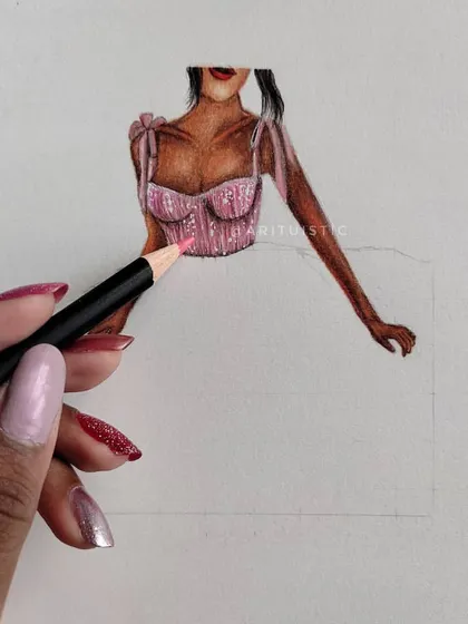 A shot of me coloring the pink dress, showing the process in action.
