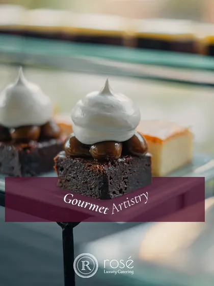 A close-up of a decadent brownie topped with caramel and meringue. Our gourmet artistry extends to our dessert menu, where we create sweet treats that are both indulgent and beautiful.