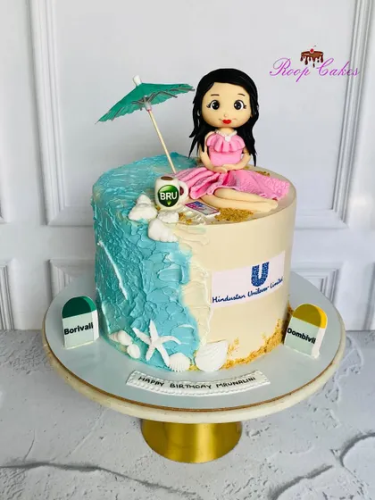 Life is too short for ordinary cake. This custom creation features a beach scene on one side and corporate logos on the other, reflecting the client's life and passions.