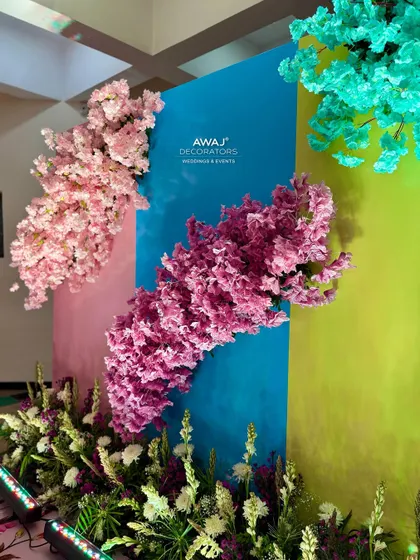 A close-up of the floral bursts on the photo wall, showcasing the beautiful pastel color palette.