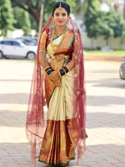 A full view of Sahana's stunning bridal ensemble. My makeup and hair styling are designed to complete the vision of a perfect South Indian bride.