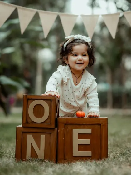 Capturing the pure, infectious joy of a first birthday. These pre-birthday shoots are all about fun and personality, creating adorable portraits that celebrate this huge milestone.