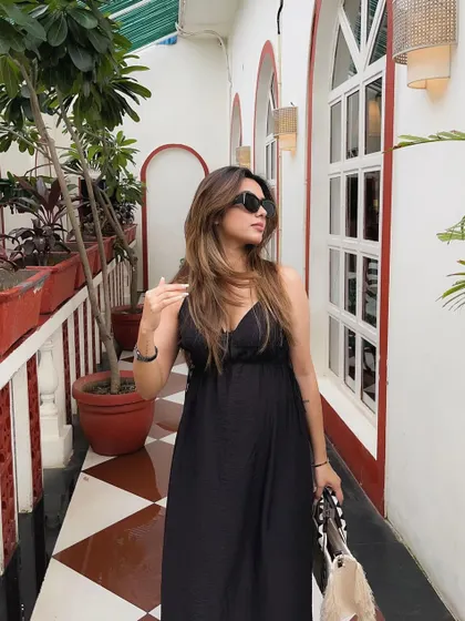 A full-length view of my favorite black maxi dress, a summer staple.