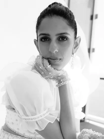 A close-up of the 'moonlit elegance' look. The sheer gloves and intricate top are all about those subtle, high-fashion details.