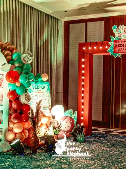 This corner of the safari party featured the milestone board, a balloon column, and a lit-up entrance gate, showing how different decor elements can be grouped to create a visually interesting area.