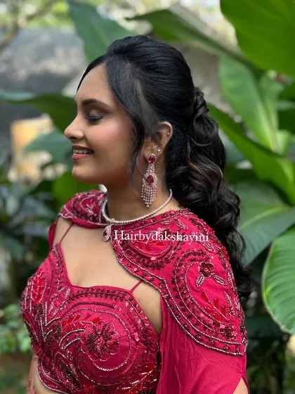 The final look. A beautiful side-swept ponytail with soft curls, framing the face perfectly.