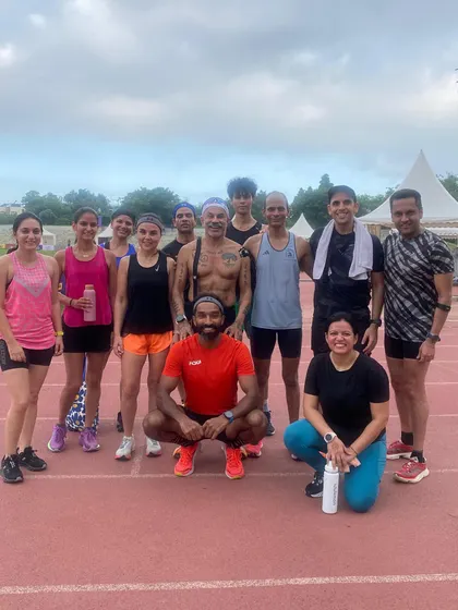 Another angle of our track workout group. The smiles after the effort say it all. This is what community and shared goals look like.