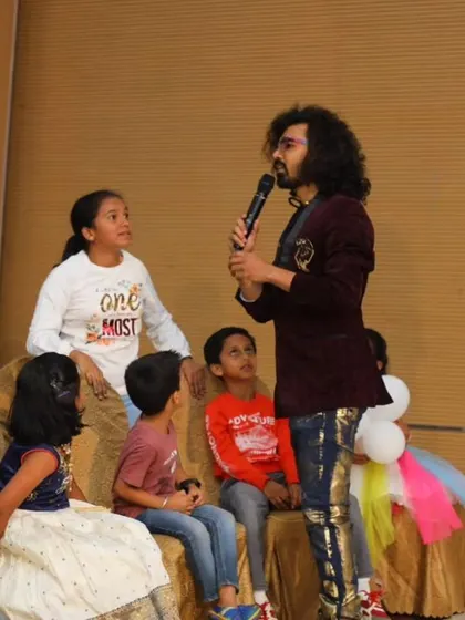 Engaging with the youngest audience members during a birthday party magic show. I make sure even the little ones feel included and captivated by the performance.