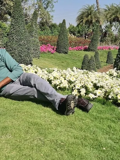 Relaxing on a perfectly manicured lawn, surrounded by beds of white flowers and sculpted topiary. These are the moments of peace that a good garden can provide.
