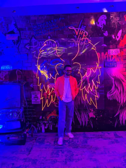 A stylish shot of me at a neon-themed after-party. I always dress to match the vibe of the event, whether it's a formal reception or a crazy party.