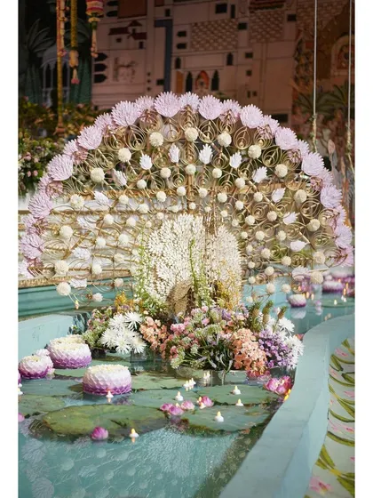 A magnificent floral peacock, dancing in a water body amidst floating lotuses. This handcrafted piece was a highlight of 'The Eternal Krishna' theme, symbolizing grace and beauty.