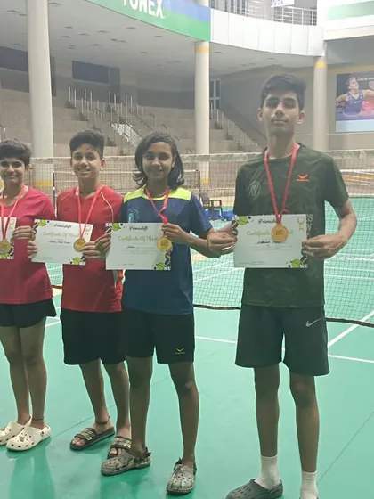 Our players showcasing their medals and certificates after a successful tournament. This image features winners and runners-up from the Primeshift Badminton tournament, including Sneha (Winner GS U-18) and Siddhant Thakur (Winner BS U-15).