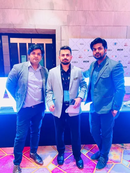 Networking with other architects and designers at an industry event.