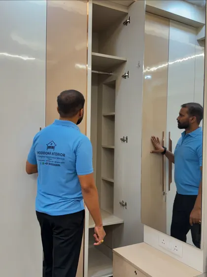This wardrobe includes an integrated dressing mirror on one of the shutters, a smart way to combine two functions in one piece of furniture.